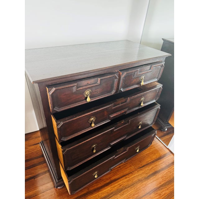 Crafted in the early 20th century from solid quartersawn English oak, this exceptional Jacobean style dresser showcases a...