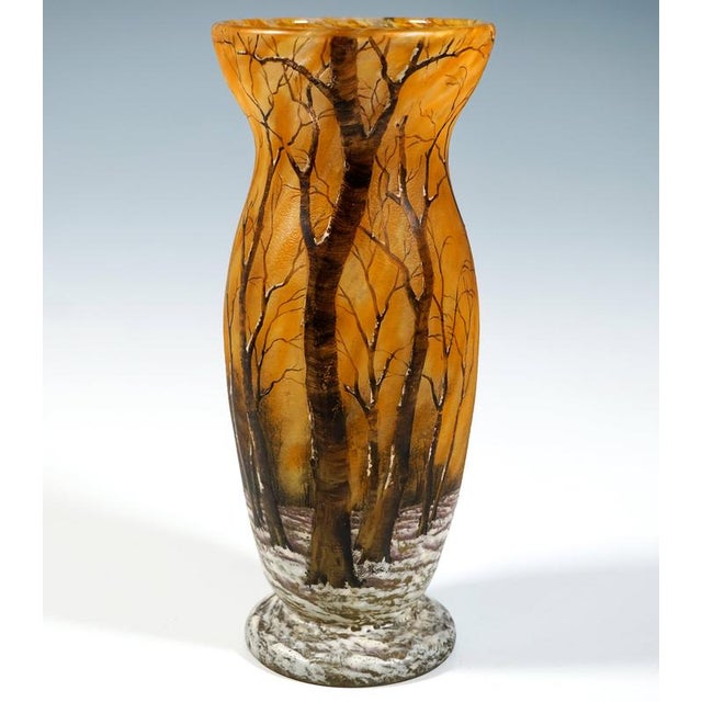 Baluster vase on a stepped round base, bulbous and tapered, with a rim that widens upwards from a slight constriction at...
