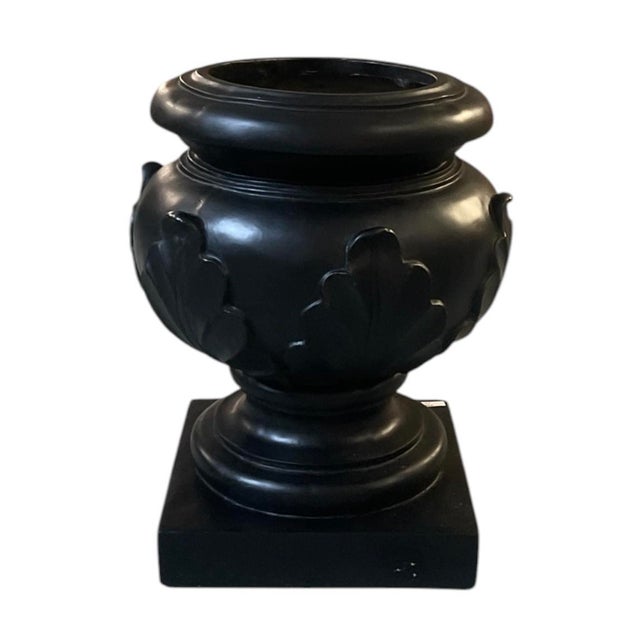This striking vintage cachepot urn masterfully combines classic Neoclassical architecture with a bold, dramatic flair....