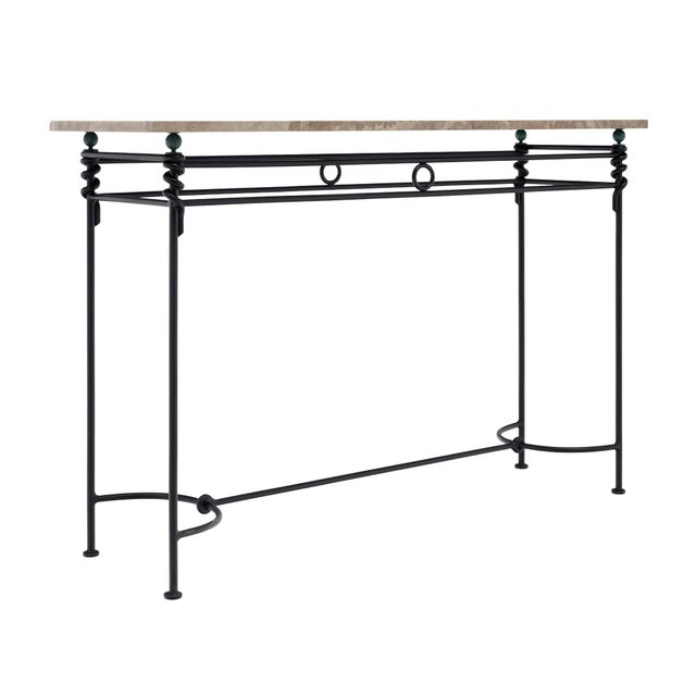 Console table from France with a rectangular marble top in gray and cream tones. The marble is supported by an iron base...