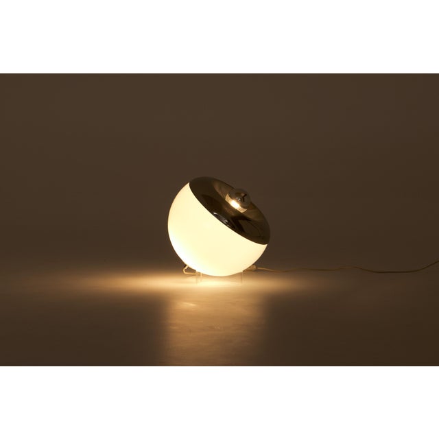 A mid-century modern table lamp, commonly referred to as the "Orbital" model, designed in the 1970s by the Italian...