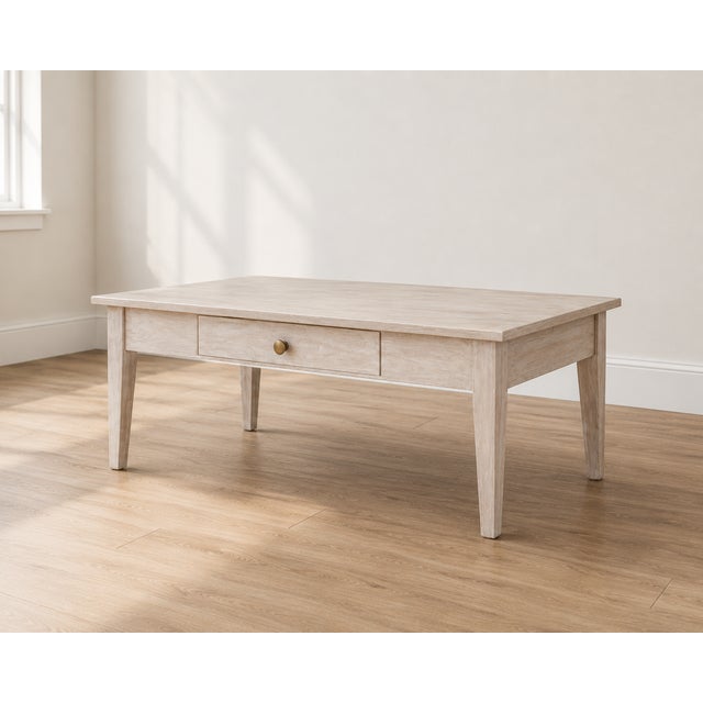 Timeless simplicity meets modern elegance with this beautifully refinished coffee table. Featuring clean lines, tapered...