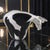 This Italian hand-blown art glass figurine features a black and white spotted cow design, adding a decorative touch to any...