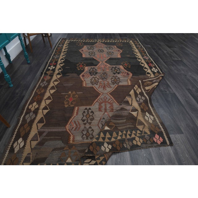 Vintage Hand-Knotted runner rug is a semi-antique vintage runner rug. The '70s Eastern region of Anatolia's unique rug is...