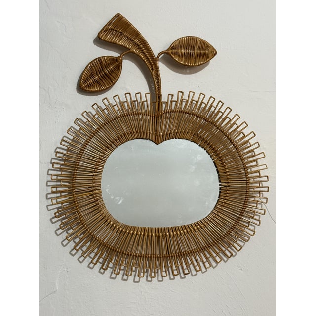 Magnificent 1960s apple-shaped woven rattan mirror. Handcrafted.