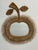 Magnificent 1960s apple-shaped woven rattan mirror. Handcrafted.