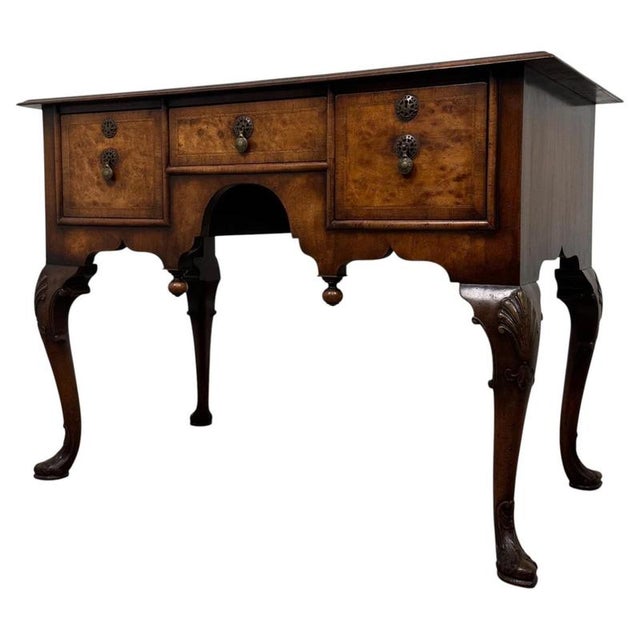A particularly handsome and finely crafted 20th-century writing table, beautifully finished in richly figured burr walnut...