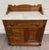 This is a beautiful antique late 1800s Victorian Eastlake style walnut and burled inlay marble top cabinet, commode, or...