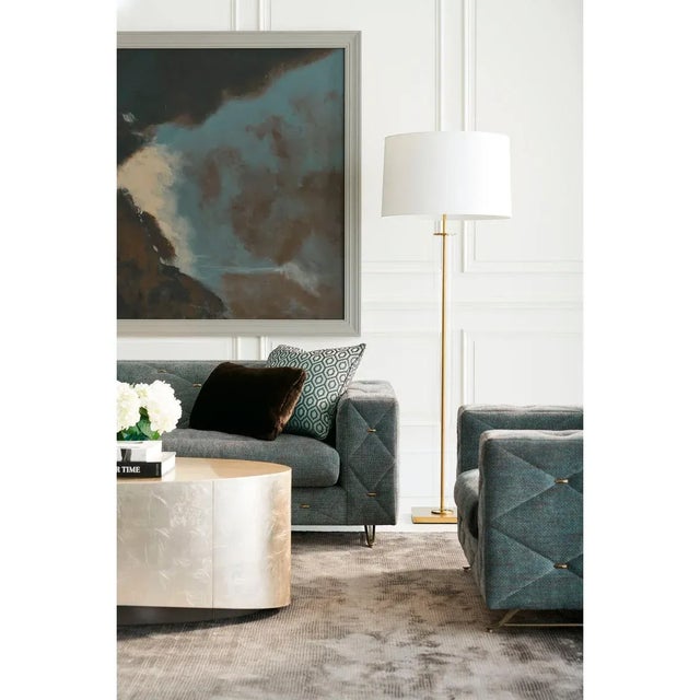 Not only does the oval shape encourage easy movement and flow around a seating area, this clever cocktail table adds such...