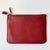 Vintage Home is pleased to offer this 1996 Coach Red Leather Cosmetic Pouch. It has a zipper closure on the top. The...