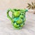 A sculptural mid-century ceramic fruit pitcher by INARCO, model E2611. Molded pears, citrus fruit, grape clusters and...