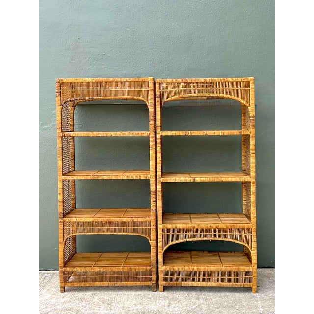 Elevate your interior with this stunning pair of vintage woven rattan etageres, a captivating blend of organic warmth and...