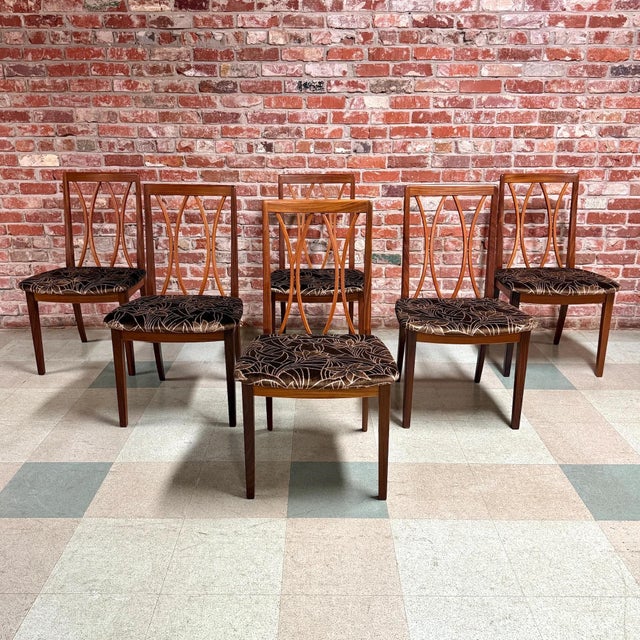 Vintage mid-century modern teak and Afromosia dining chairs designed by Leslie Dandy for G-Plan of High Wycombe, UK....