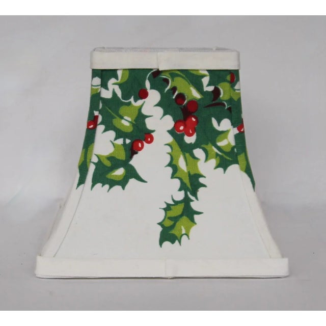 Christmas lamp shade made from old wire form using vintage holly motif tablecloth fabric. Shade has candelabra clip, shade...