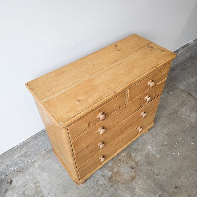 Dimensions: 40.75"W x 17.5"D x 41"H A lovely late-19th century English pine chest, circa 1880, full of the gentle...
