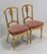 Pair of gilded wooden chairs, of Louis XVI style. Their curved and fluted amounts are richly molded in upper and central...