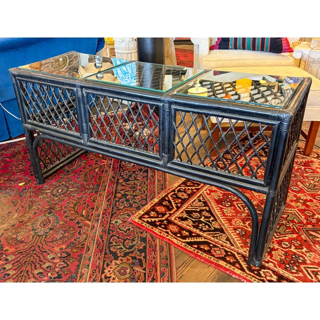 Boho chic bamboo or rattan console table, also suitable as a desk. Painted black with 3 glass insert tops. Modesty panel...