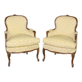 French Louis XV Carved Walnut Bergere in Yellow Upholstery With Flowers For Sale