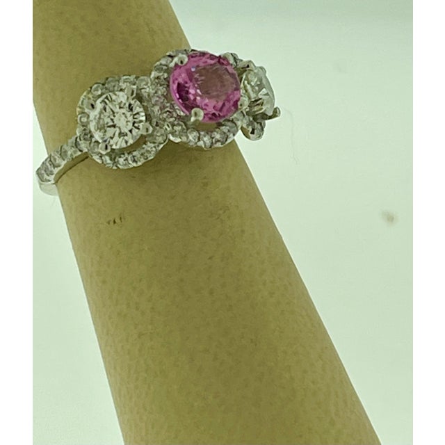 A classic, Ring weight of 1 Ct natural Pink sapphire and 1.5 ct Round Diamond 18 Karat White gold Ring All round brilliant...