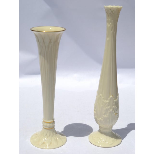 Set of two tall Lenox Florentine and Tivoli Collection Bud Vases in ivory porcelain, each featuring intricate acanthus...