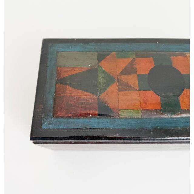 Fantastic early 1900s storage box adorned with rustic handmade inlay wood top. The inlay features various varieties of...