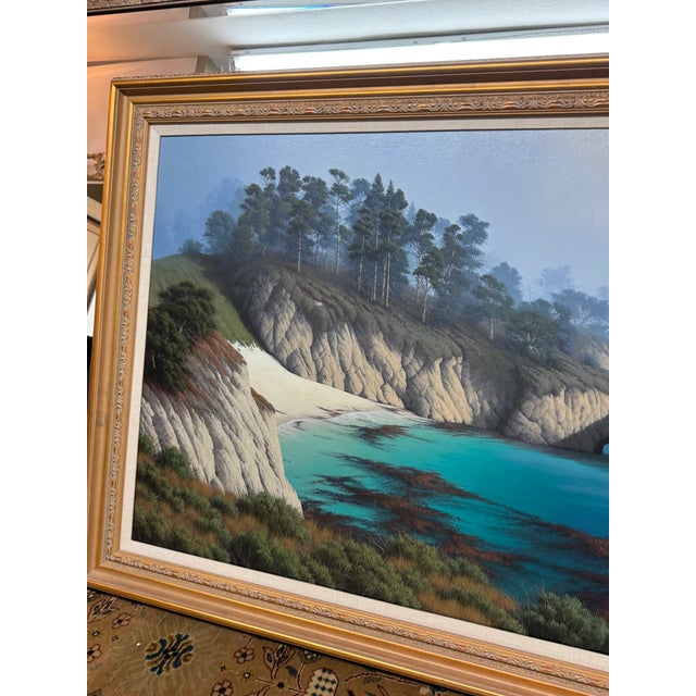 Design Plus Gallery presents a Monterey Bay Cove Oil Painting by David Dalton. The painting has hyperrealistic view of the...