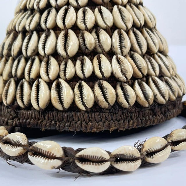 The Lega Bwami Society hat was crafted in the eastern regions of the Democratic Republic of Congo. This woven, palm fiber...