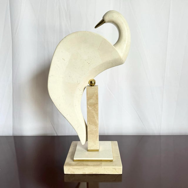 This Postmodern Tessellated Stone and Brass Bird Sculpture by Maitland-Smith is a stunning fusion of organic textures and...