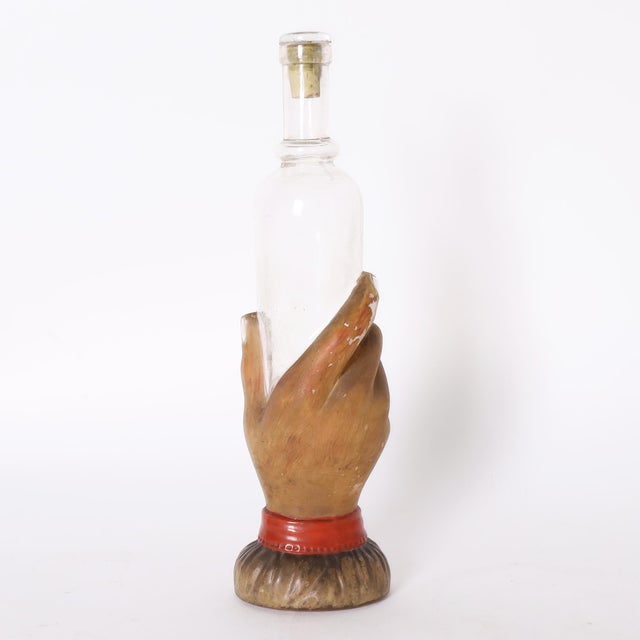 Antique French glass bottle pressed into a whimsical hand form decorated with paint. Please see our other listings for the...