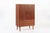 This vintage mid century Danish modern teak storage or bar cabinet was made in Denmark circa 1960. The classic...