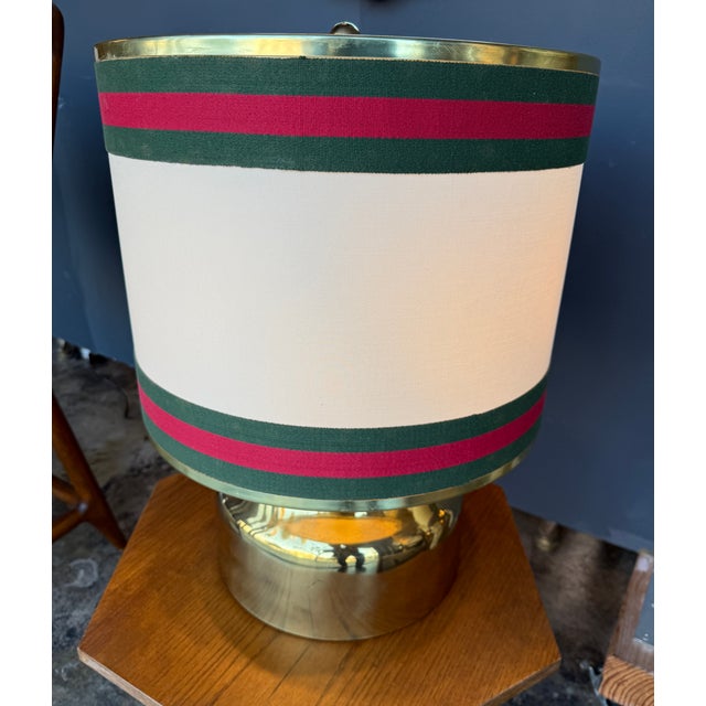 A refined Italian table lamp that embodies the elegance of mid-century design. The base, crafted from polished solid...