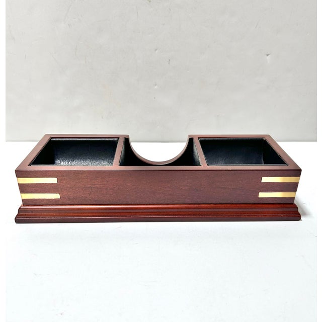 Elegant and functional, this 2003 Bombay Company valet organizer features a rich mahogany-finished wood frame accented...