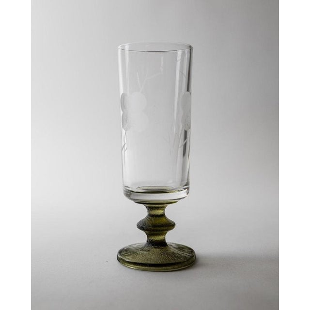This vintage set of 4 Champagen glasses from the 1970s beautifully combines elegant craftsmanship with subtle decorative...