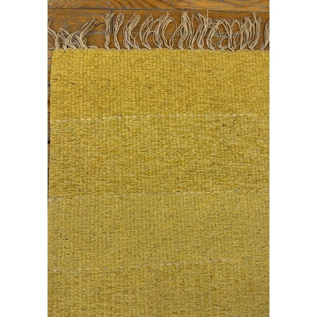 This 1960 Swedish Kilim runner perfectly captures the mid-century modern aesthetic that continues to influence...