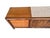 A classic mid-century modern triple dresser by Witz Furniture, crafted in the United States and showcasing the clean lines...