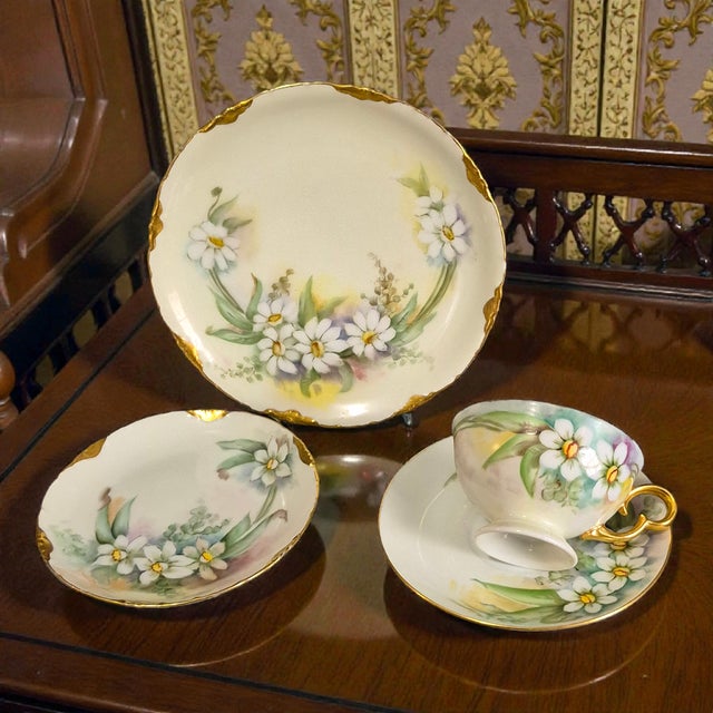 The R.C. Versailles Bavaria Painted Gilded White Floral Porcelain 4-piece Tea Set is a vintage tea set originating from...