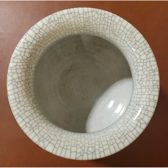 Vintage Chinese enameled porcelain vase or urn featuring colorful flowers, leaves, and geometric motifs. Nice crackle...