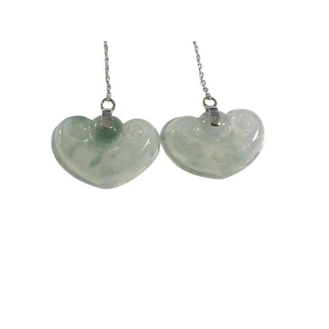 Elegant 18K white gold earrings feature Ruyi -shaped blue rice water jadeite jade, Measuring 2.5" in height and 0.75" in...