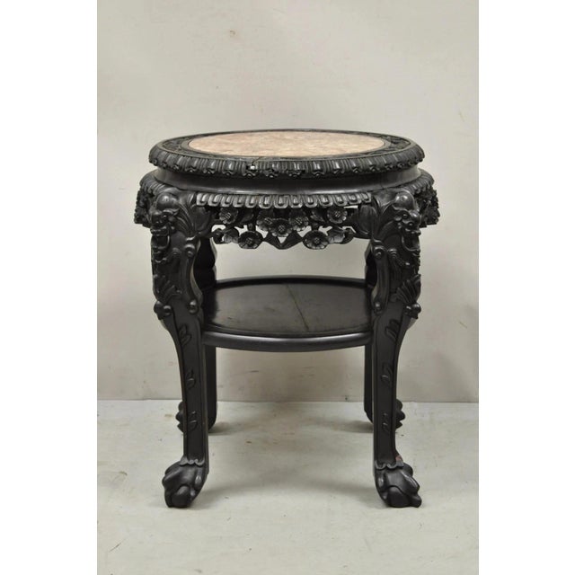 Antique Oriental Chinese Carved Hardwood Marble Top Foo Dog Side Table. Item features lower shelf, pink marble top, Foo...