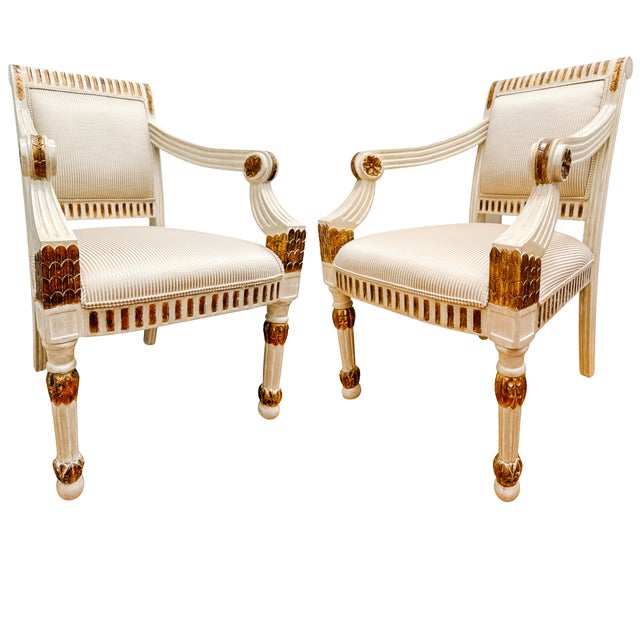 A pair of vintage Italian Neoclassical armchair fauteuils in classic style of late 18th to early 19th-century Italian...