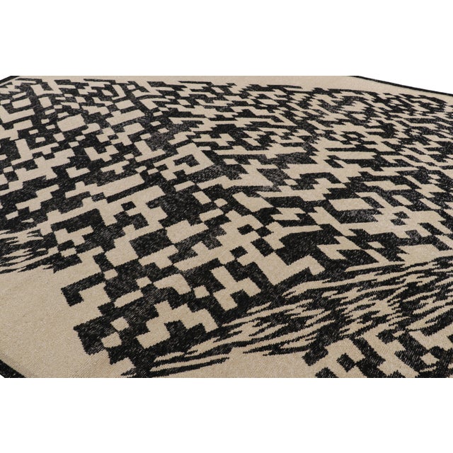 Hand-knotted in wool, this 9x12 modern rug, originating from India, as inspired by modern art with a take on geometric...