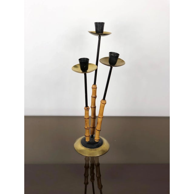 Candleholder in brass, metal and bamboo with three arms, Italy, circa 1970.