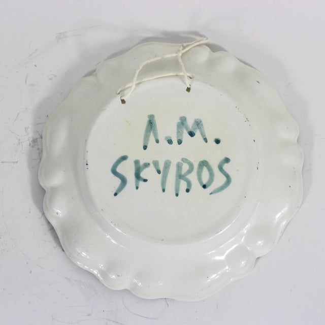 Width: 7 inches Depth: 1 inches Stunning vintage, hand painted ceramic wall plate. It has a string on the back for easy...