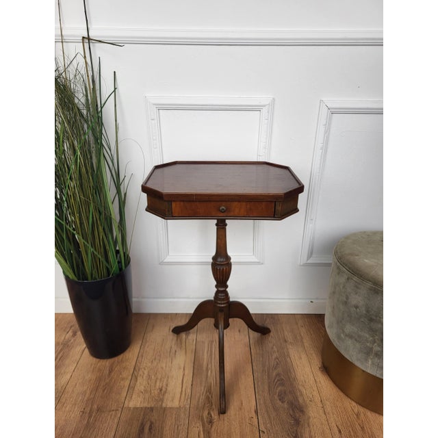 A beautiful italian walnut octagonal side table with great details and frames shaped in victorian, napoleon iii, louis xv...