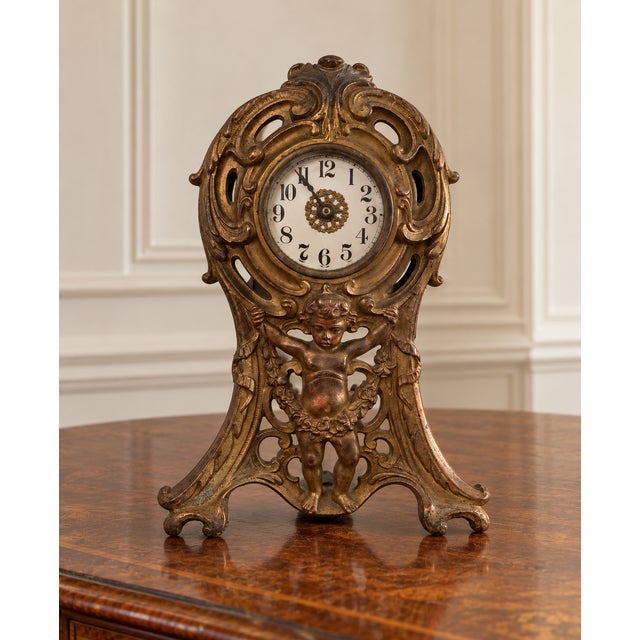 Over a century old and still keeping time today, this extraordinary early 20th-century American mechanical mantel clock is...