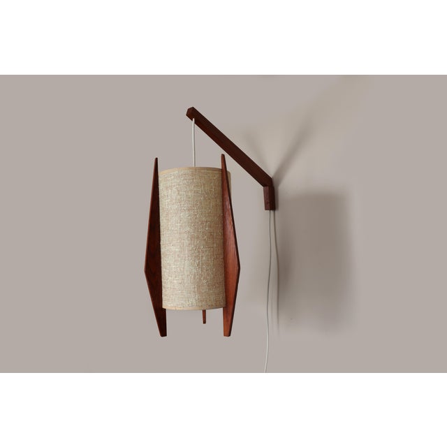 This mid 20th century modern danish wall lamp has an adjustable cantilever arm that allows the lamp to be positioned where...