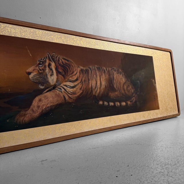 This long, horizontal Japanese wall decoration depicts a resting tiger, rendered with great attention to fur texture and...