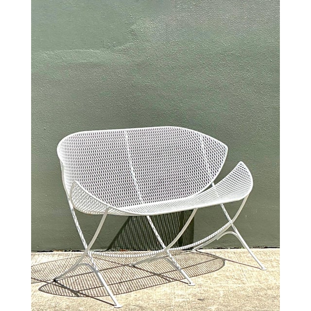 An iconic example of American mid-century outdoor design, this vintage Salterini "Orange Slice" bench showcases the...