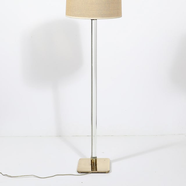 Elevate your lighting decor with the Mid-Century Modern Translucent Lucite & Polished Brass Floor Lamp, designed by Hansen...