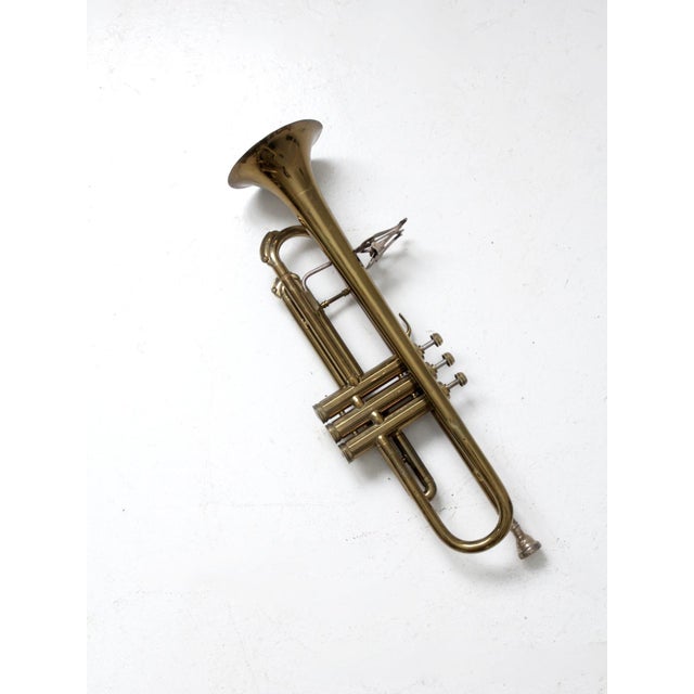 This is a vintage CG Conn brass trumpet with case. Case: 21.75" x 8" x 6" .. 55.2 cm x 20.3 cm x 15.2 cm Length with mouth...